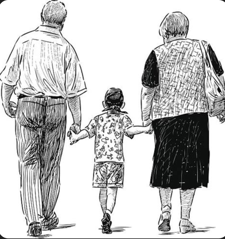 Grand parents walking with grandchild down a street